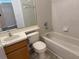 Bathroom showcasing a tub and shower, a vanity with mirror, and tiled flooring at 3713 S Lake Orlando Pkwy # 6, Orlando, FL 32808