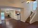 Bright living space with high ceilings, fireplace and stairs that blends seamlessly to the dining and kitchen areas at 3713 S Lake Orlando Pkwy # 6, Orlando, FL 32808