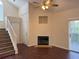 Living room features a fireplace, staircase, and sliding glass doors, seamlessly blending comfort and convenience at 3713 S Lake Orlando Pkwy # 6, Orlando, FL 32808