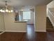 Inviting living area with bar top looking into kitchen and stairs offering seamless flow, ideal for entertaining at 3713 S Lake Orlando Pkwy # 6, Orlando, FL 32808