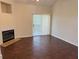 Cozy living room features a fireplace and sliding glass doors, seamlessly blending indoor and outdoor living at 3713 S Lake Orlando Pkwy # 6, Orlando, FL 32808
