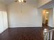 Bright living room boasting a ceiling fan, high ceiling, and wood flooring, creating a spacious and welcoming atmosphere at 3713 S Lake Orlando Pkwy # 6, Orlando, FL 32808