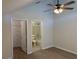 Bedroom featuring a ceiling fan, closet, and en-suite bathroom for added convenience at 3713 S Lake Orlando Pkwy # 6, Orlando, FL 32808