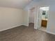 Bedroom with laminate floors featuring ensuite bathroom and walk in closet at 3713 S Lake Orlando Pkwy # 6, Orlando, FL 32808