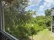 Scenic view from the screened-in balcony overlooking lush greenery and a serene outdoor landscape at 3713 S Lake Orlando Pkwy # 6, Orlando, FL 32808