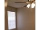 Bedroom boasts a ceiling fan and natural light from the window at 420 Forestway Cir # 202, Altamonte Springs, FL 32701