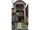 Exterior of tan apartment building with dark brown trim, balconies and brick accent with landscaping at 420 Forestway Cir # 202, Altamonte Springs, FL 32701