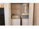 Close-up of a washing machine, dryer, and water heater in a closet at 420 Forestway Cir # 202, Altamonte Springs, FL 32701