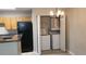 A washer, dryer and water heater are in the closet outside of the kitchen at 420 Forestway Cir # 202, Altamonte Springs, FL 32701