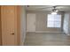 Living room showcases light, wood-look floors, a front door, and a ceiling fan at 420 Forestway Cir # 202, Altamonte Springs, FL 32701