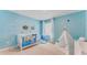 Bedroom featuring under the sea wall decorations, crib, and teepee at 5174 Masser Rd, St Cloud, FL 34772
