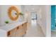 Bright entryway features neutral tile flooring, decor, and leads into the living area at 5174 Masser Rd, St Cloud, FL 34772