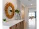Bright hallway features neutral tile flooring, decor, and leads into the living area at 5174 Masser Rd, St Cloud, FL 34772