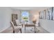 Home office with work space, chairs, and shelving by the window at 5174 Masser Rd, St Cloud, FL 34772