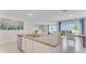 Open kitchen and dining area featuring granite counters and stainless steel dishwasher at 5174 Masser Rd, St Cloud, FL 34772