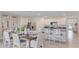 Bright kitchen features granite countertops, stainless steel appliances, and an adjacent dining area at 5174 Masser Rd, St Cloud, FL 34772