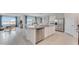 Open kitchen with an island, stainless steel appliances, and a view of the living area at 5174 Masser Rd, St Cloud, FL 34772