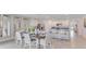 Bright kitchen features granite countertops, stainless steel appliances, and adjacent dining area at 5174 Masser Rd, St Cloud, FL 34772