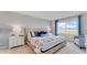 Serene bedroom with a comfortable bed, a large window, and soothing decor at 5174 Masser Rd, St Cloud, FL 34772