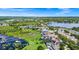 Lakeside community aerial view featuring homes with dock access, set against a backdrop of lush greenery at 5552 Remsen Cay Ln, Windermere, FL 34786