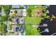 Aerial view of the property showing the large lot with pool, the screened in lanai, and the dock on the lake at 5552 Remsen Cay Ln, Windermere, FL 34786