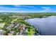 Beautiful aerial view of a lakeside community highlighting homes with docks and serene lake access at 5552 Remsen Cay Ln, Windermere, FL 34786