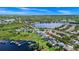 Aerial view of the community showcasing waterfront homes and lake access, along with neighborhood greenery at 5552 Remsen Cay Ln, Windermere, FL 34786