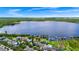 Panoramic aerial view of waterfront property showcasing lake views and convenient dock access at 5552 Remsen Cay Ln, Windermere, FL 34786