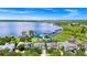 Picturesque aerial view showcasing waterfront homes with private docks, complete with stunning lake scenery at 5552 Remsen Cay Ln, Windermere, FL 34786