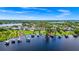 Breathtaking aerial view of waterfront homes with private docks, nestled in a picturesque lakeside setting at 5552 Remsen Cay Ln, Windermere, FL 34786