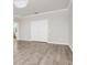 Spacious room with hardwood floors, a modern chandelier and white trim throughout at 5552 Remsen Cay Ln, Windermere, FL 34786