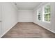 Neutral bedroom with hardwood floors and natural light at 5552 Remsen Cay Ln, Windermere, FL 34786