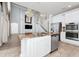 Island kitchen design with granite countertops, stainless appliances, open to living space and staircase at 5552 Remsen Cay Ln, Windermere, FL 34786