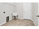 Laundry room with tile floor, utility sink and door to the house at 5552 Remsen Cay Ln, Windermere, FL 34786