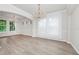 Bright and airy living room with hardwood floors and elegant chandeliers at 5552 Remsen Cay Ln, Windermere, FL 34786