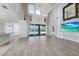 Bright, open living room with high ceilings, hardwood floors, and lake views at 5552 Remsen Cay Ln, Windermere, FL 34786