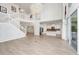 Open concept living area with a grand staircase, island kitchen, and large sliding glass doors at 5552 Remsen Cay Ln, Windermere, FL 34786