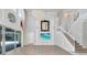 Spacious living room featuring high ceilings, a grand chandelier, and a staircase at 5552 Remsen Cay Ln, Windermere, FL 34786