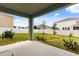 Back yard with covered patio and white vinyl fence at 5846 Sw 80Th Ln, Ocala, FL 34476