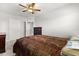 Cozy bedroom with ceiling fan and neutral walls is carpeted and contains two dressers at 5846 Sw 80Th Ln, Ocala, FL 34476