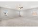 Bright and airy main bedroom with plush carpeting, neutral paint, and a ceiling fan at 5846 Sw 80Th Ln, Ocala, FL 34476
