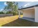 Exterior of the house with a covered patio overlooking the spacious backyard at 6291 Sw 133Rd Street Road, Ocala, FL 34473