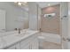 Bathroom features marble tile, modern fixtures, and ample vanity storage at 6291 Sw 133Rd Street Road, Ocala, FL 34473