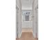 Hallway view of bathroom featuring double sinks and a shower at 6291 Sw 133Rd Street Road, Ocala, FL 34473