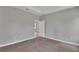 Bedroom with carpet, a doorway and natural light from two windows at 6291 Sw 133Rd Street Road, Ocala, FL 34473