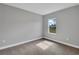 Bright bedroom with neutral walls and plush carpet at 6291 Sw 133Rd Street Road, Ocala, FL 34473