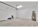 Spacious garage features white walls and concrete flooring at 6291 Sw 133Rd Street Road, Ocala, FL 34473