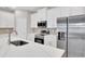 Well-equipped kitchen featuring stainless steel appliances, quartz countertops, ample storage, and modern fixtures for a stylish design at 6291 Sw 133Rd Street Road, Ocala, FL 34473