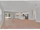 Bright, open-concept living area with hardwood floors, large windows, and seamless flow to the kitchen and outdoor space at 6291 Sw 133Rd Street Road, Ocala, FL 34473