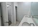 A bathroom featuring a double vanity and a linen closet at 6300 Chirpine Ln, St Cloud, FL 34771